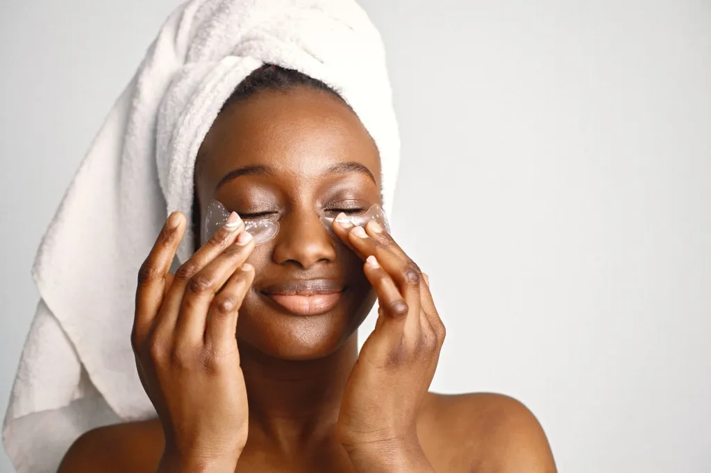 black-girl-with-towel-head-has-eye-patches-isolated-white-background.webp